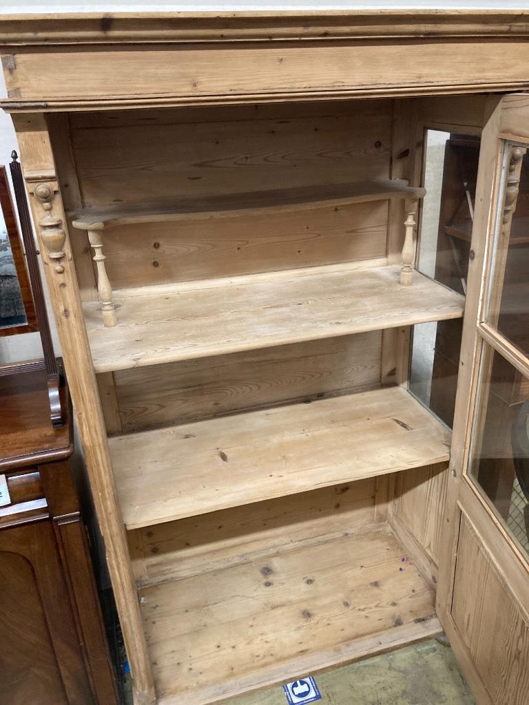 A 19th century East European pine vitrine, width 104cm, depth 52cm, height 170cm